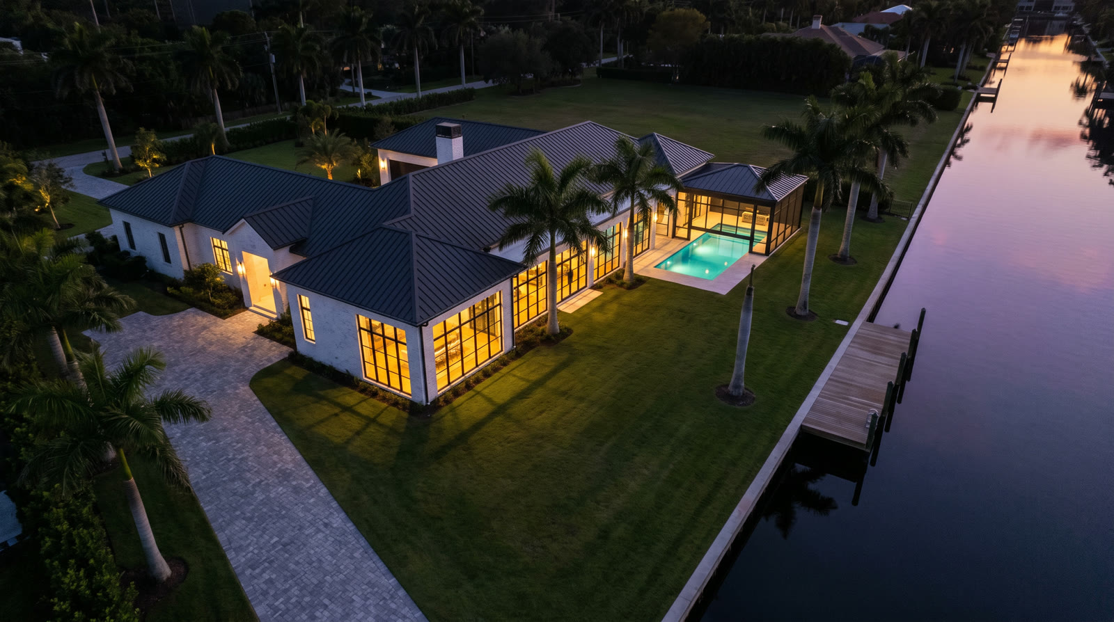 Dusk aerial of the Bayline Cove estate on the water